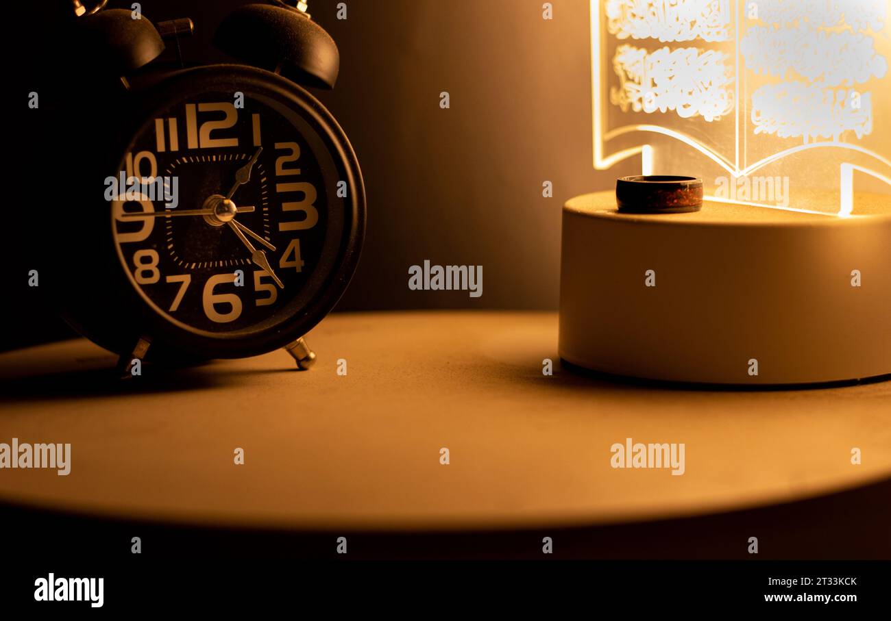 Close-up of a black alarm clock at 01:00 AM, early morning Stock Photo