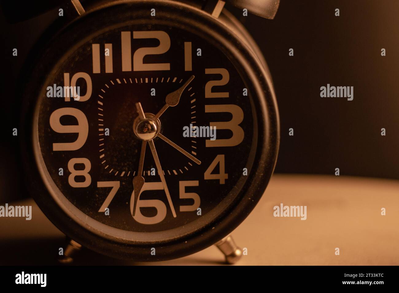 Close-up of a black alarm clock at 01:00 AM, early morning Stock Photo