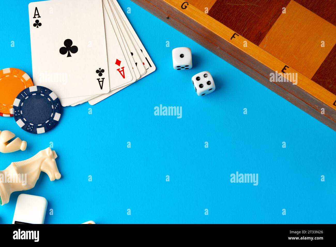 Playing cards, chips and dice on blue backgorund Stock Photo