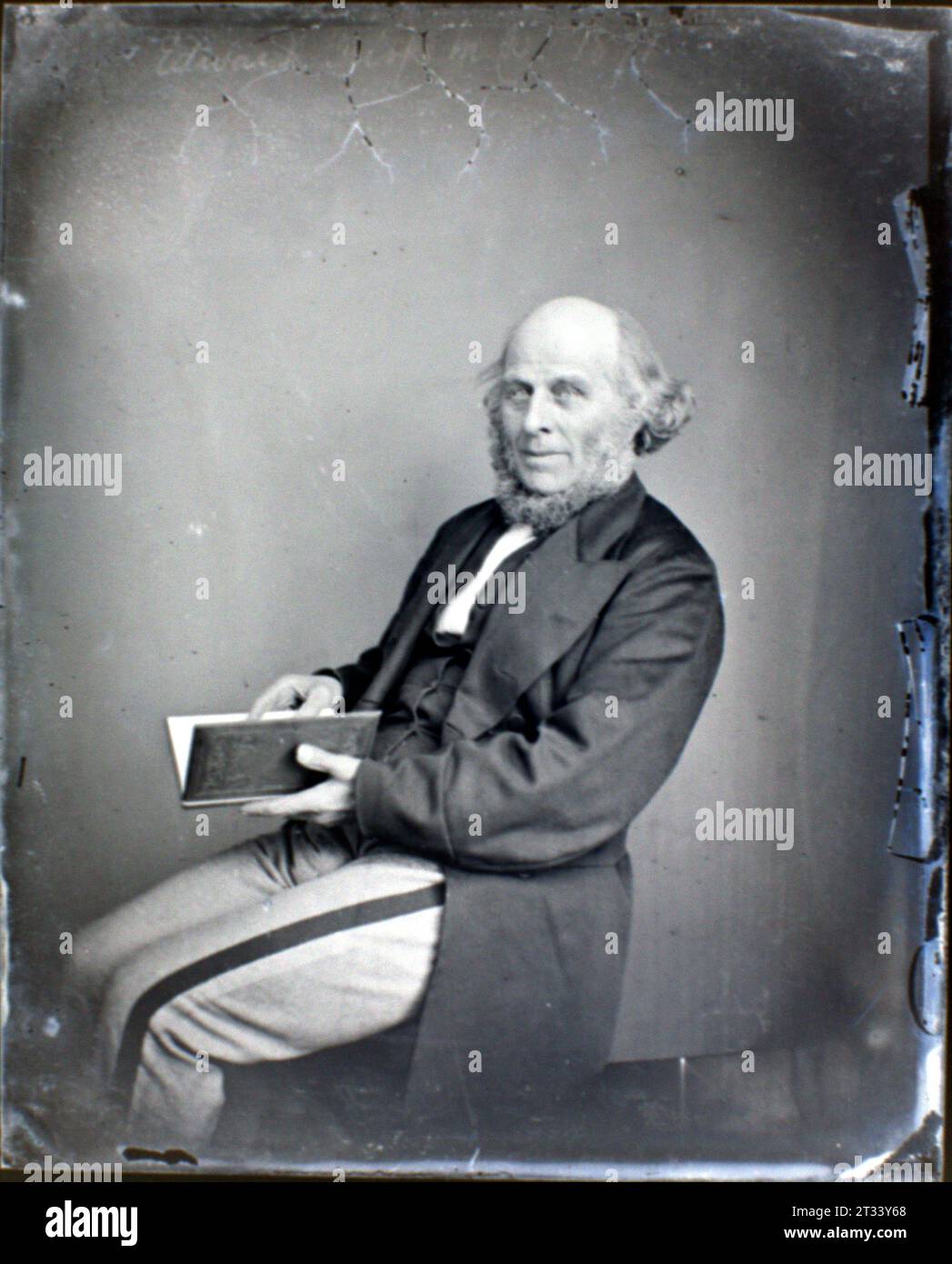 Portrait of an Elderly Gentleman, seated with book - Victorian Collodion Glass Plate c1860s Stock Photo