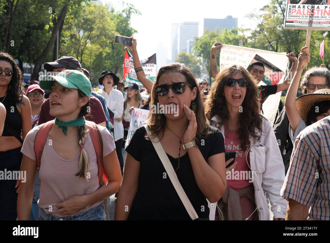 Pro-Palestine march, Mexico City, Mexico. 22nd Oct, 2023. women chant as part of the march. Thousands of people protest in Mexico City, whilst repeatedly chanting ÕItÕs not a war. ItÕs Genocide'. Many people waved Palestinian flags, others wore a keffiyeh in solidarity with the people of Palestine. Various groups formed part of the march including the Mexican Communist Party, pro-abortion activists and LGBTQ  groups. Credit: Lexie Harrison-Cripps/Alamy Live News Stock Photo