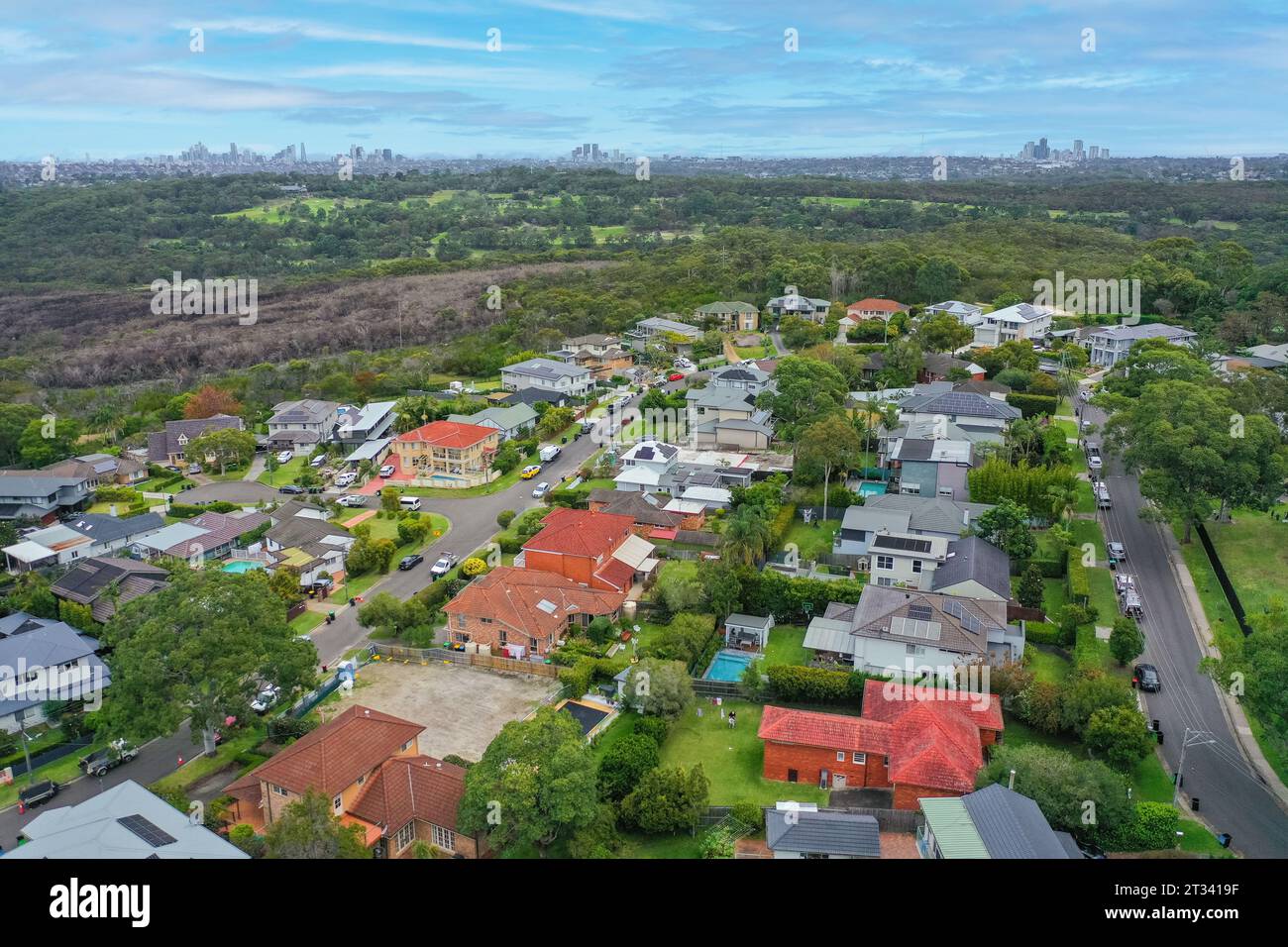 Panoramic drone aerial view over suburbs of Northern Beaches Sydney with CBD, North Sydney and Chatswood in the background. Stock Photo