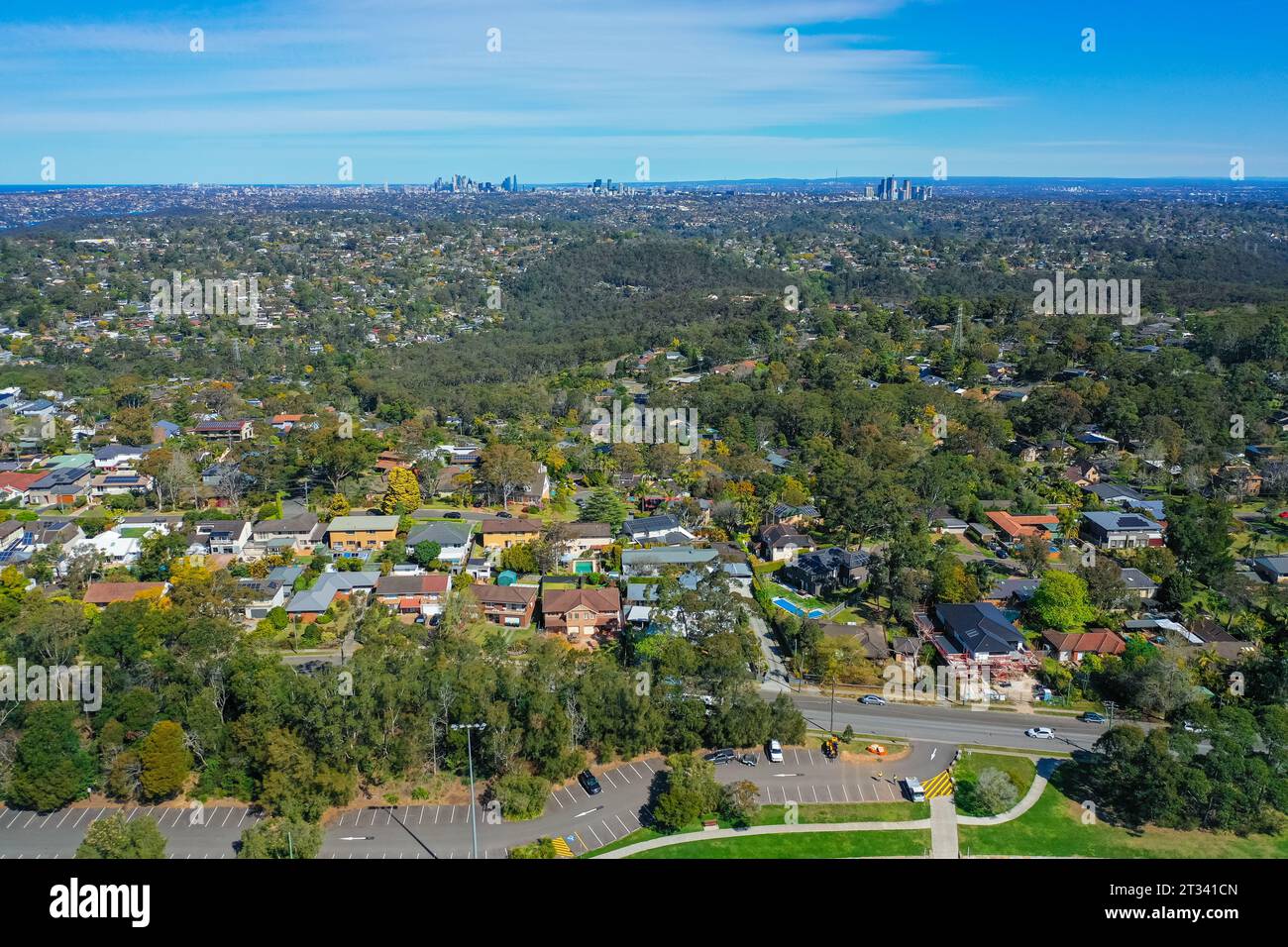 Panoramic drone aerial photo of a residential area in the Northern Beaches, with city in the distance, Sydney, Australia. Stock Photo