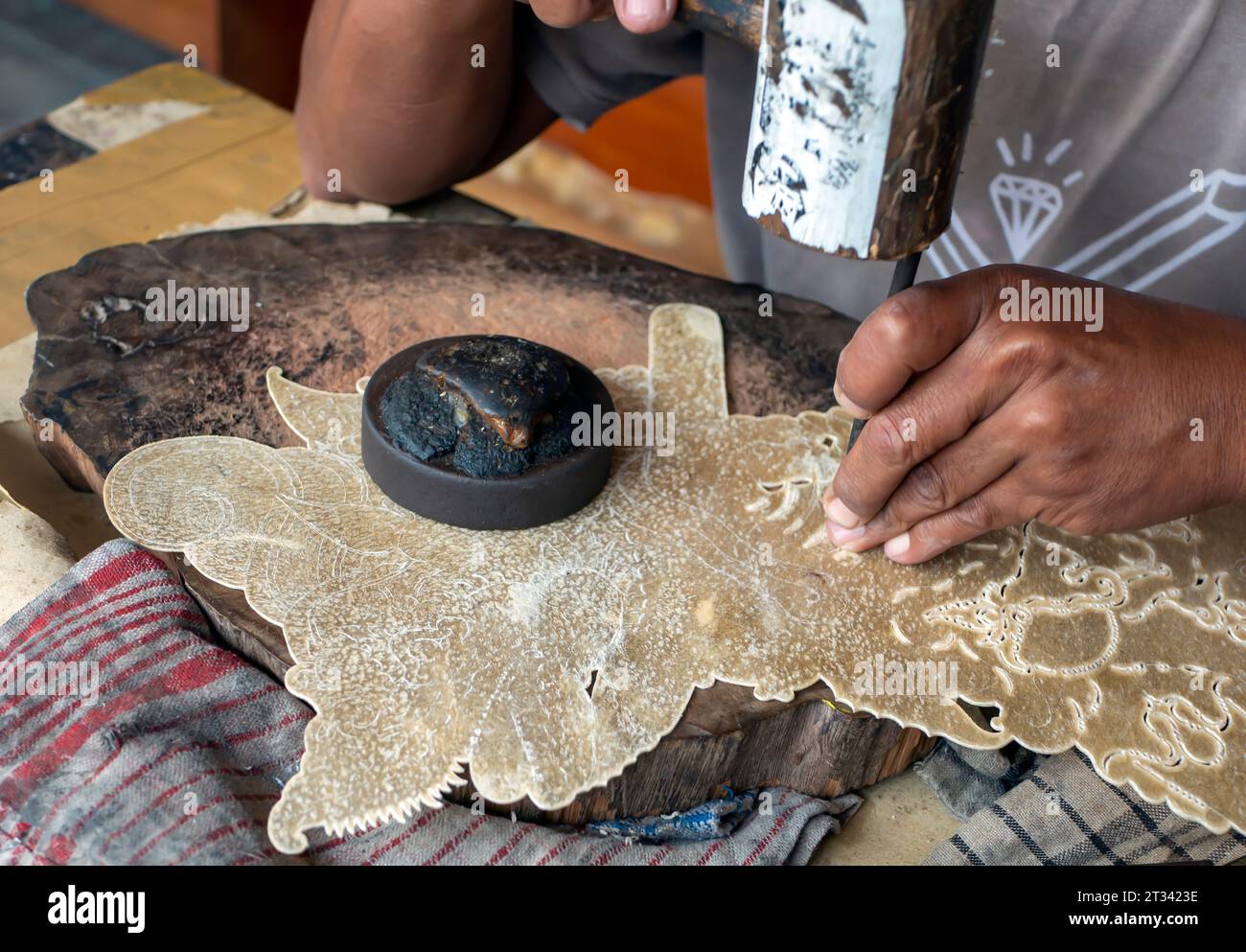 Process of making Wayang Kulit, shadow puppet, a traditional art from Java, Indonesia. Stock Photo