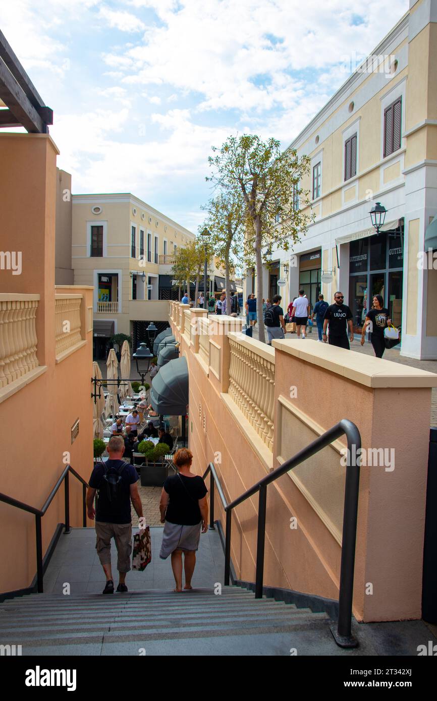 AGIRA, SICILY, Italy - 30 SEP 2023. Sicilia Outlet Village shopping centre is a popular visitor magnet. People shopping at Sicilia Outlet Village. Stock Photo