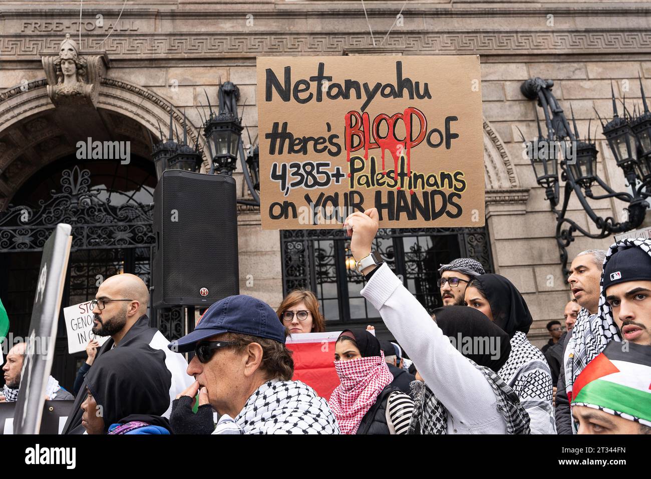 A woman holds a sign putting blame on Israeli Prime Minister Netanyahu for the more than 4,000 Palestinians dead during the latest Israeli siege on Gaza during the demonstration. Hundreds of Pro-Palestine supporters rallied in Boston, Massachusetts. Speakers from various social organizations addressed a large crowd on the steps of the Boston Public Library in Copley Square. Protesters then took to the streets marching around Boston's Back Bay neighborhood and finished the outside the Israeli Consulate in Boston. The latest in protest in Boston comes as aid trucks have begun to enter the Rafah Stock Photo