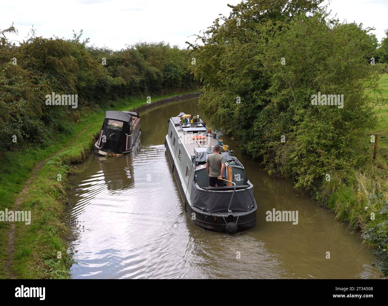 Photo of a small narrow boat which has taken on water.and is semi sunk. Stock Photo