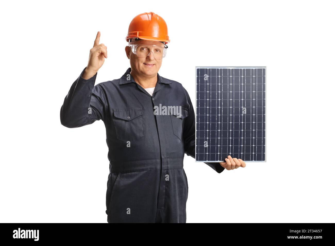 Technician holding a solar panel and pointing up isolated on white ...