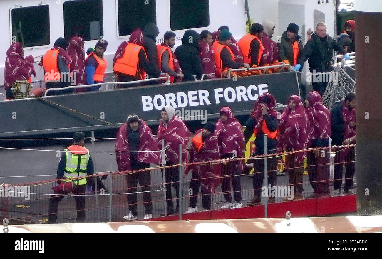 A group of people thought to be migrants are brought in to Dover, Kent, from a Border Force vessel following a small boat incident in the Channel. Picture date: Monday October 23, 2023. Stock Photo