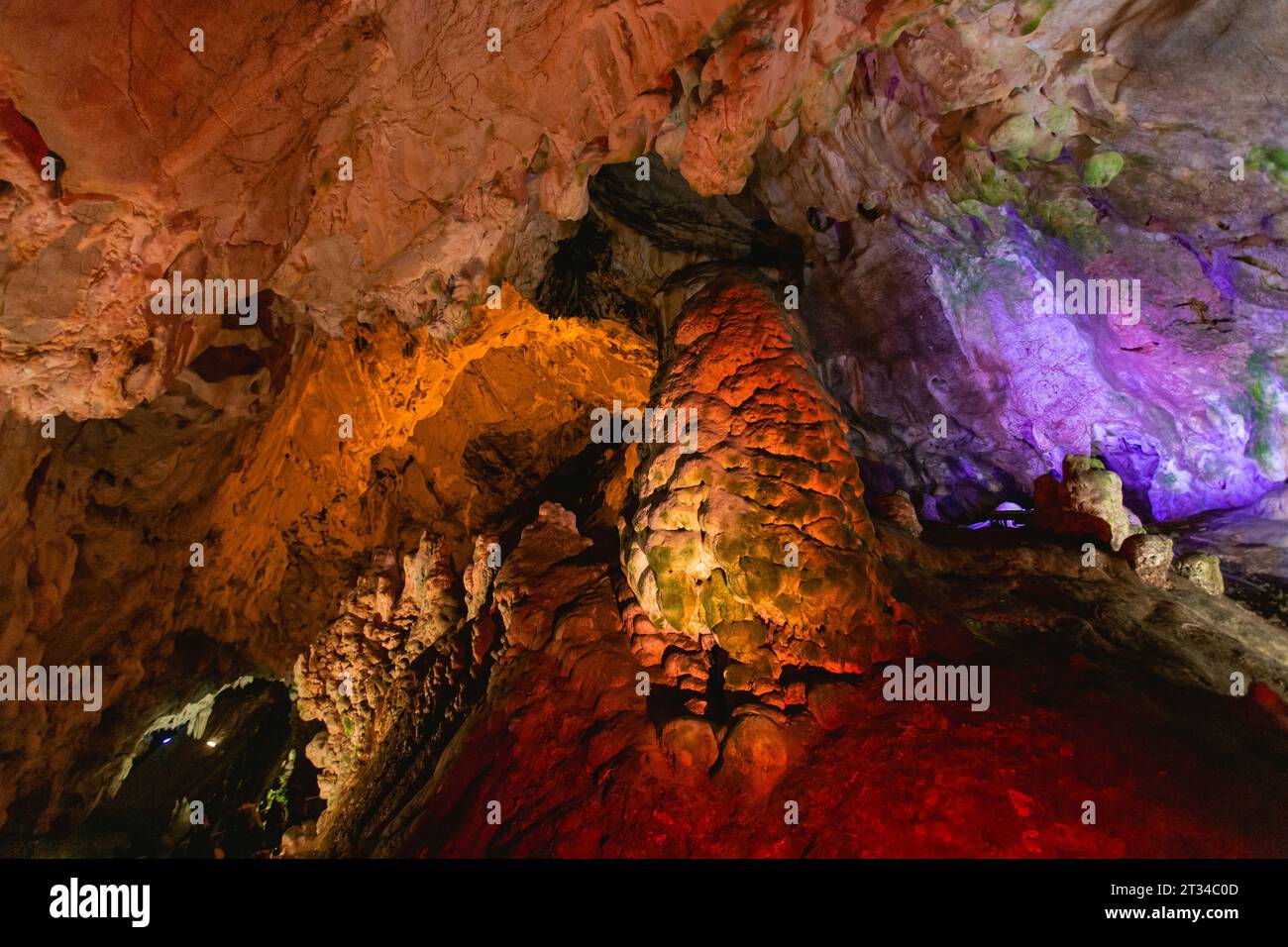 Cave illuminated with yellow and blue lights Stock Photo - Alamy