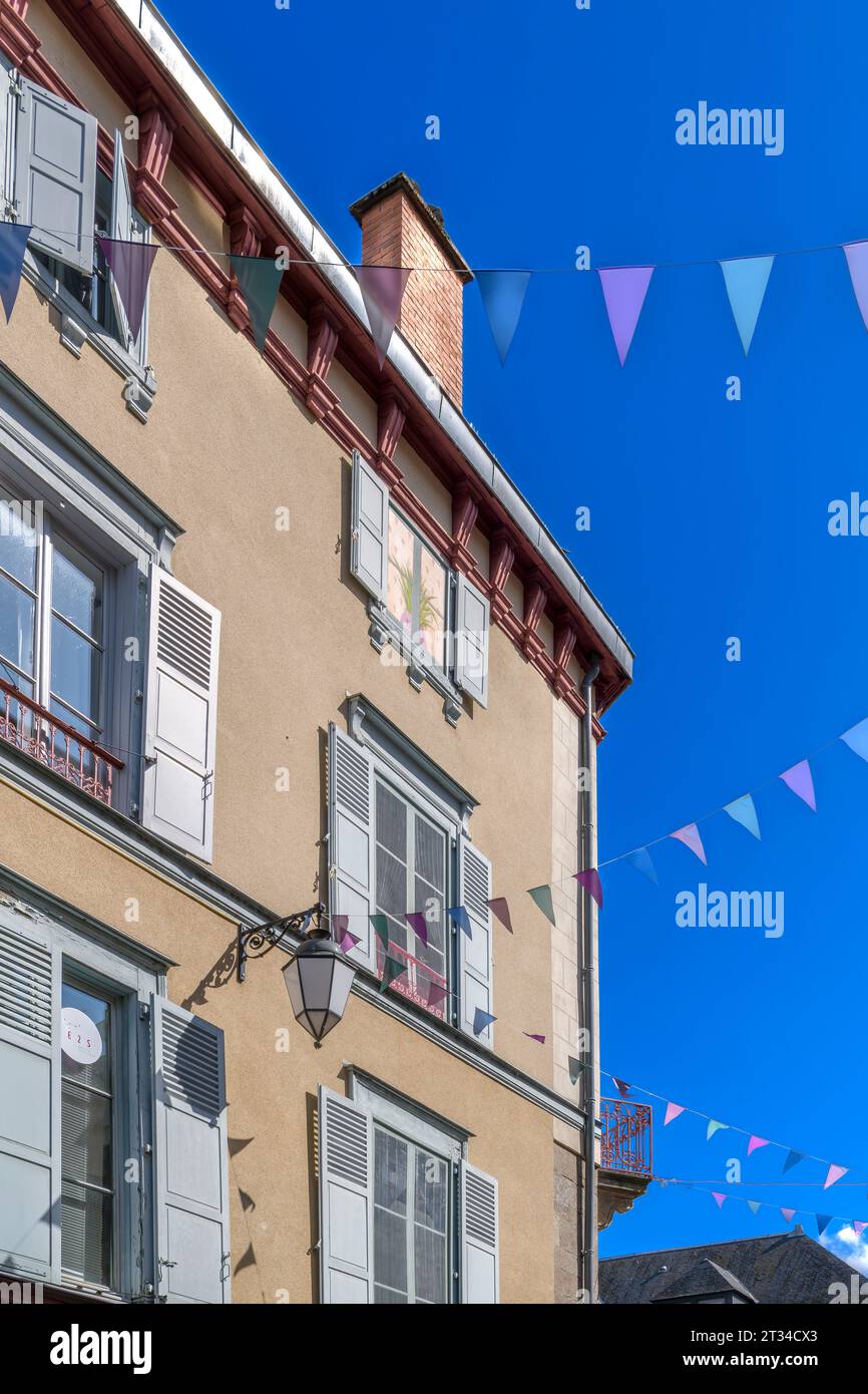 Looking up on iconic French houses with blue shutters on Rue Dalesme