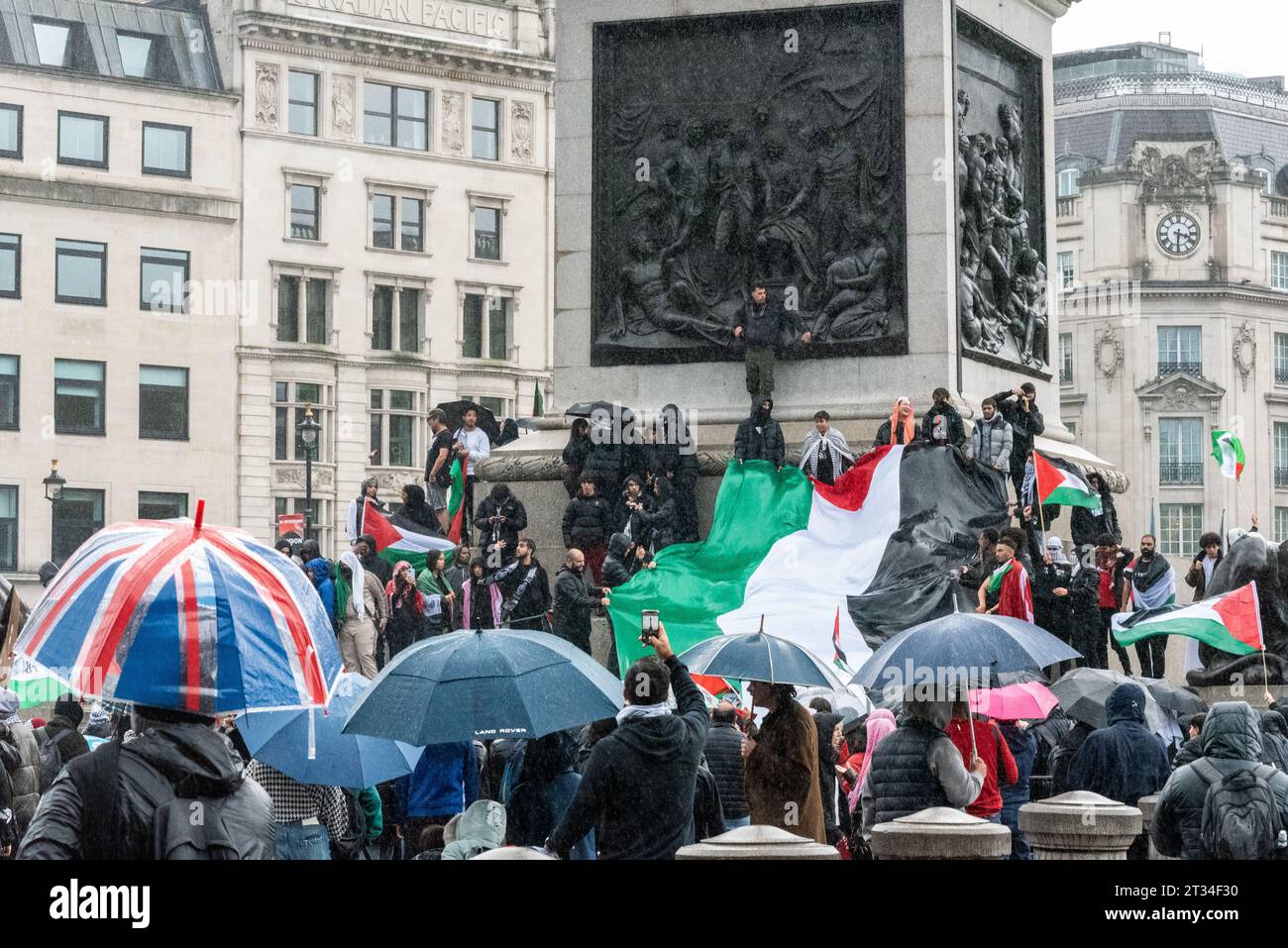 Protesters gathering by Nelson's Column in Trafalgar Sq at Free Palestine protest, London following the escalation of the conflict in Israel and Gaza Stock Photo