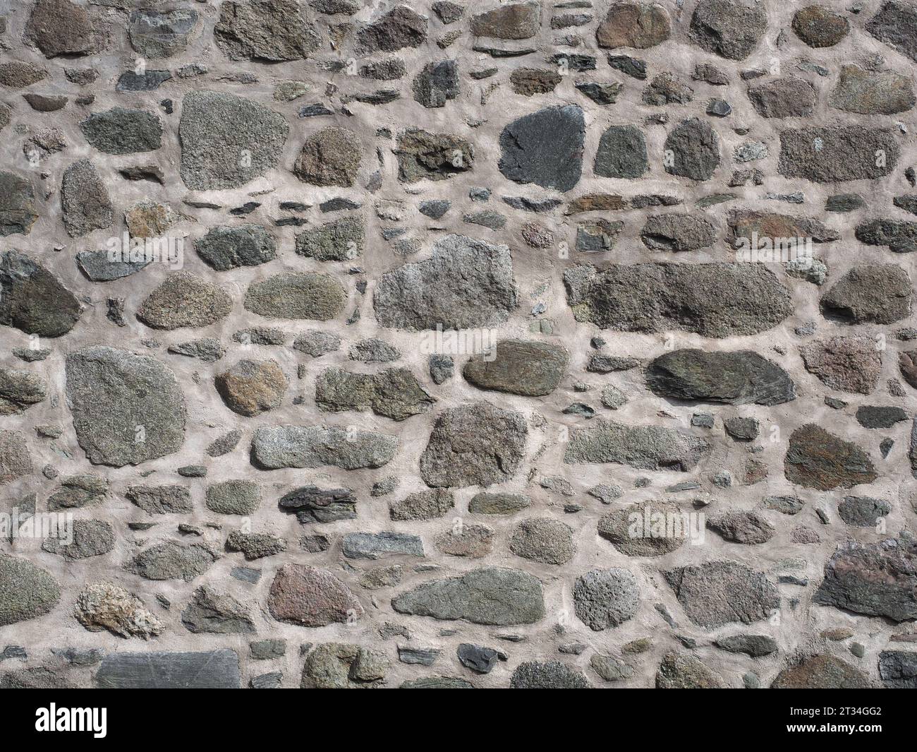 grey stone wall useful as a background Stock Photo - Alamy