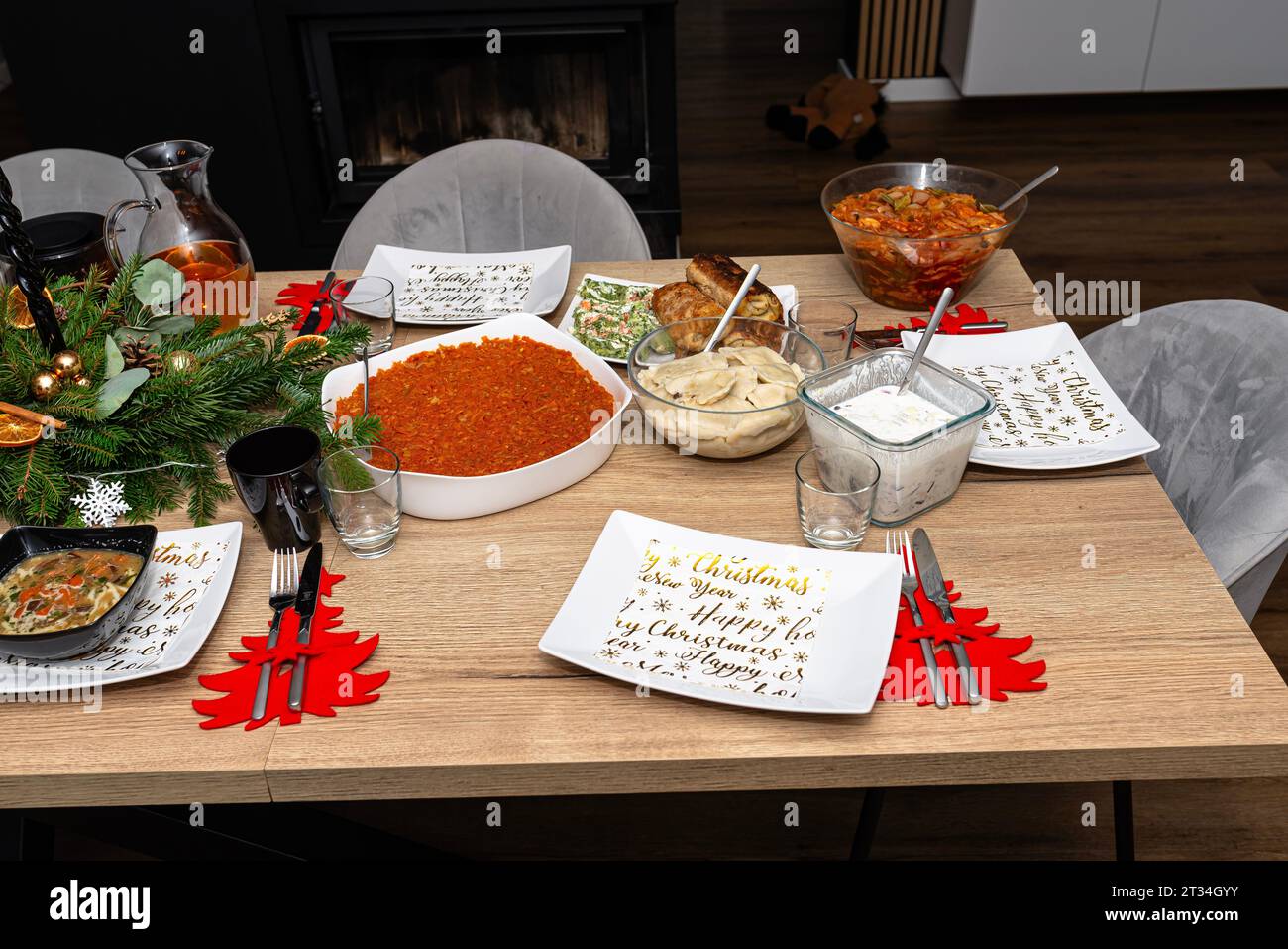 A table set before Christmas dinner with many traditional Polish dishes. Stock Photo