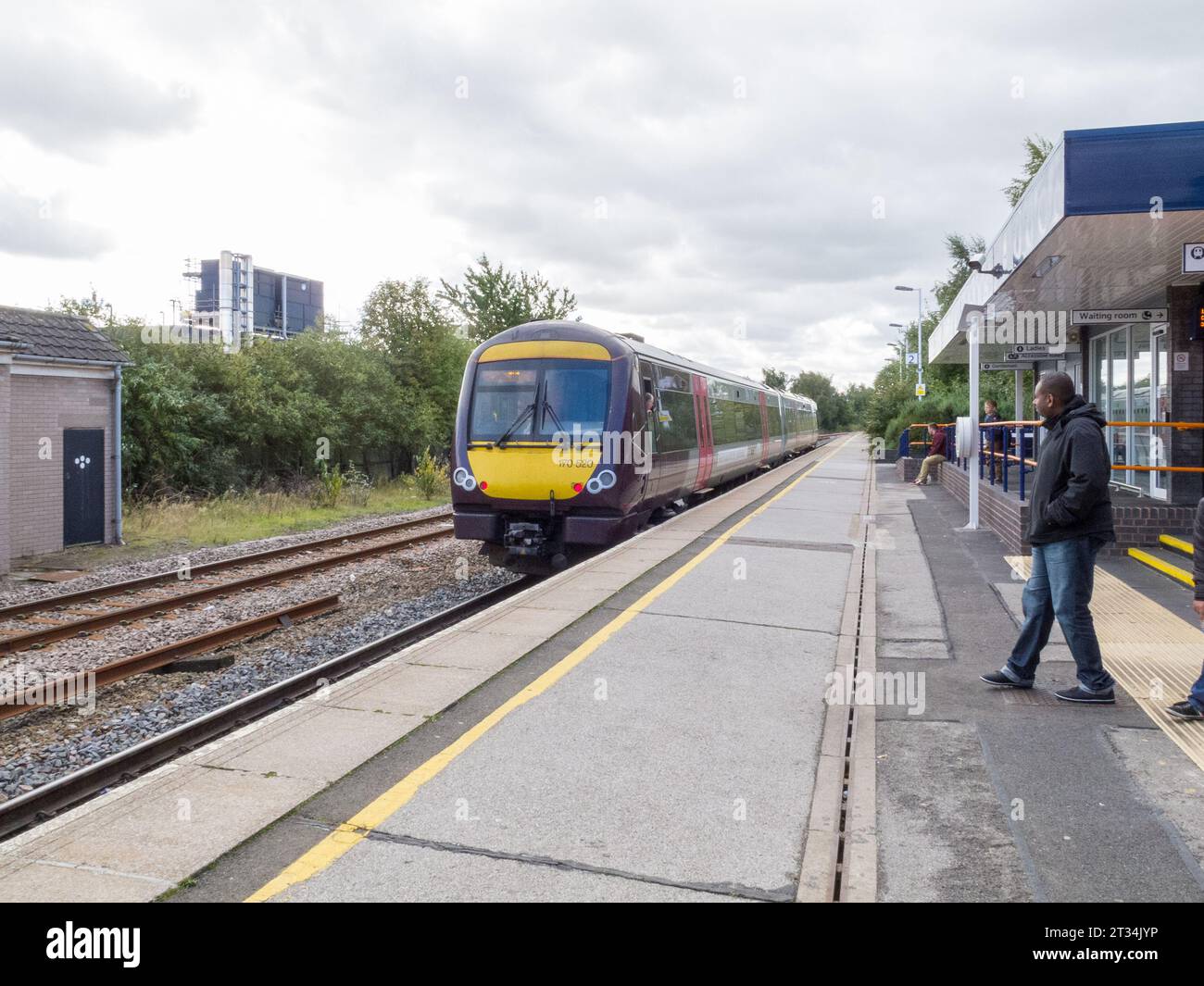 A train departing from Burton on Trent train station Stock Photo