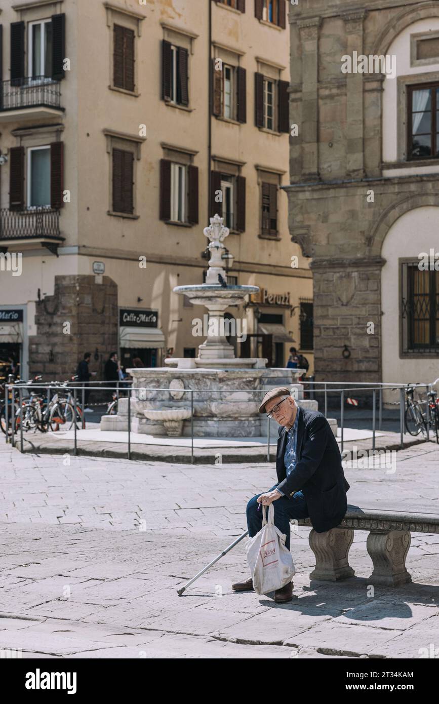 Old italian man on bench Stock Photo