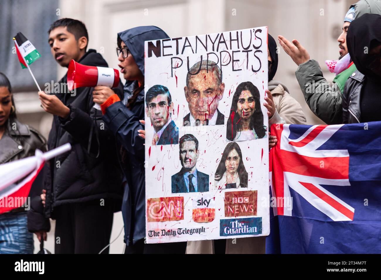 Bloodied placard with Netanyahu and British politicians at Free Palestine protest in London following the escalation of conflict in Israel and Gaza Stock Photo