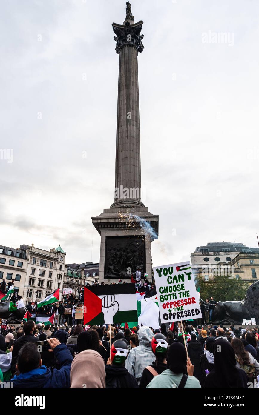 Protesters fire fireworks in Trafalgar Square at a Free Palestine