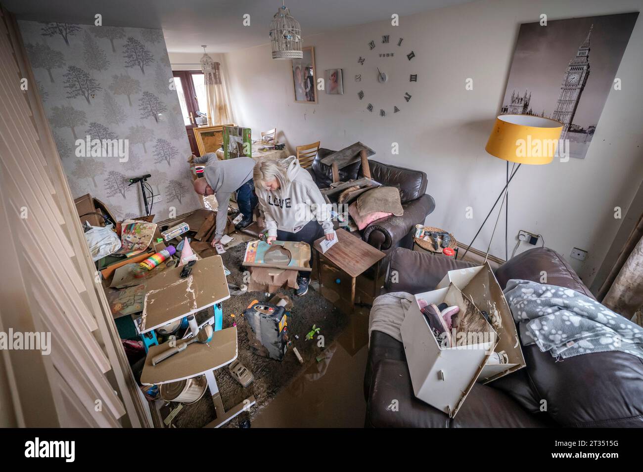 Lynsey France and David Pickering inspect flood damage in their home in ...