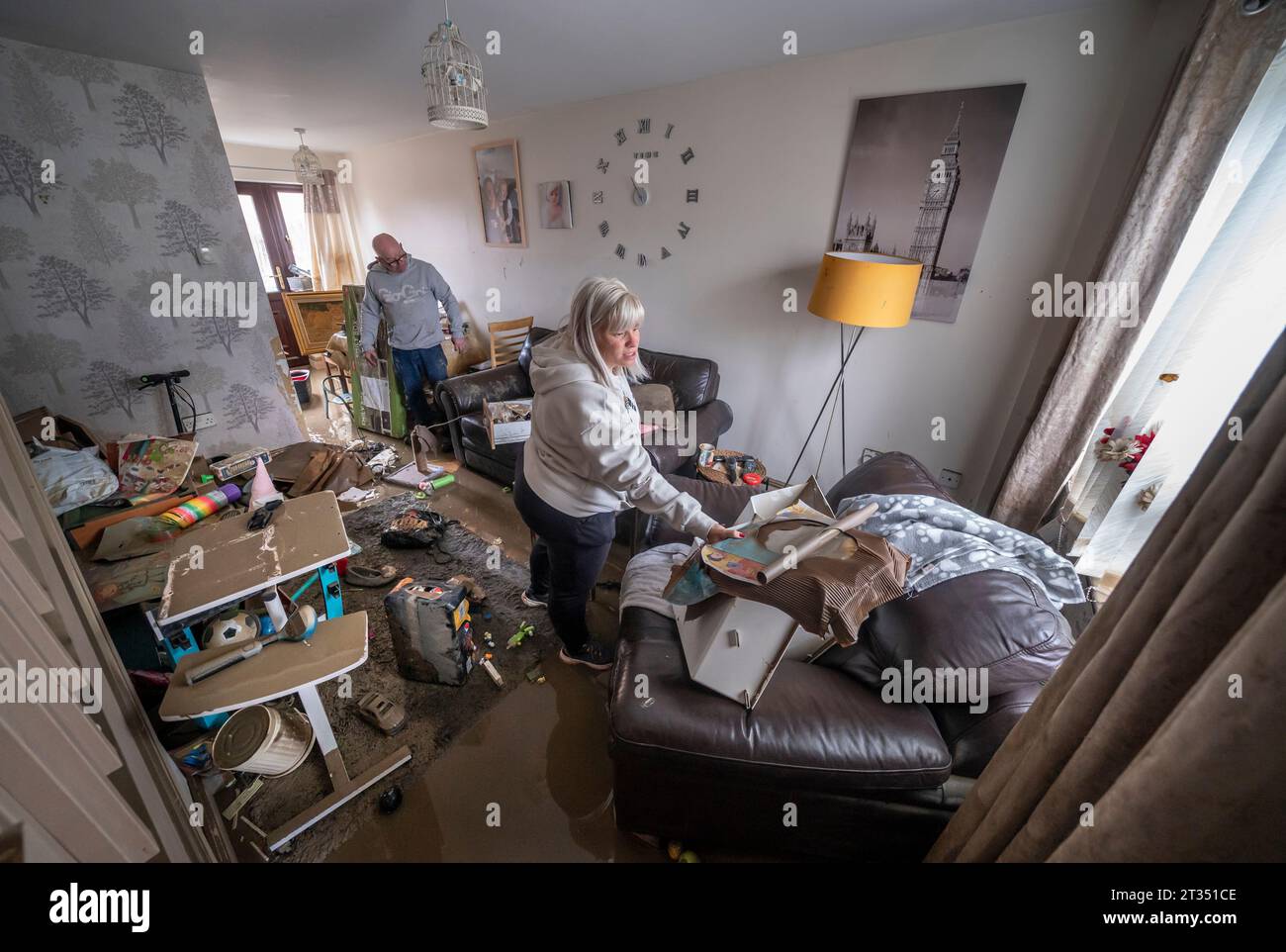 Lynsey France and David Pickering inspect flood damage in their home in ...