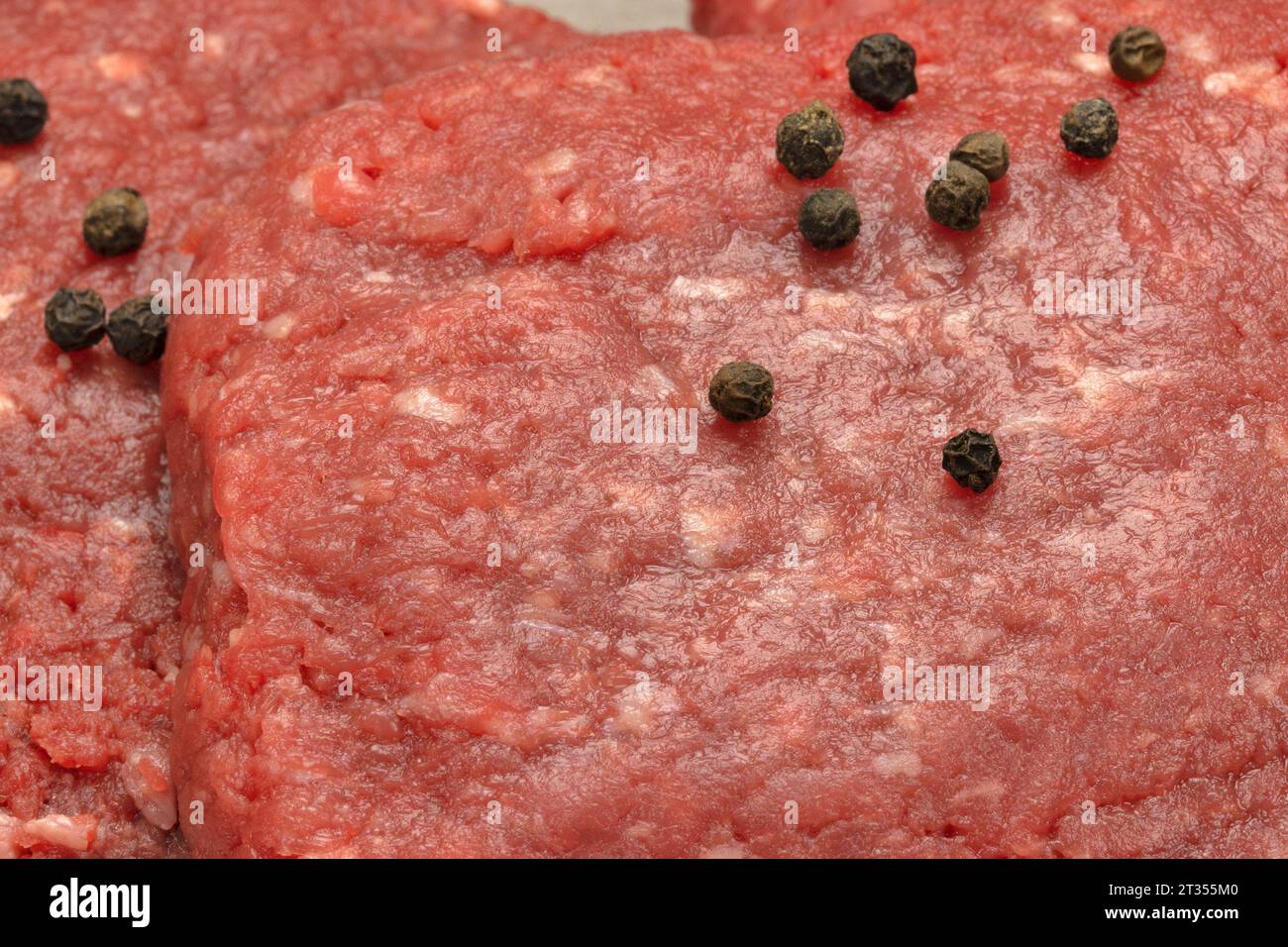 raw beef minced steaks, close-up, isolated on a table Stock Photo