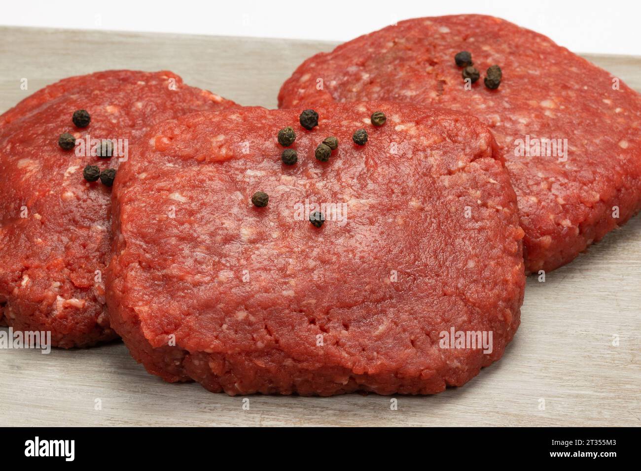 Raw beef minced steaks, close-up, isolated on a white background Stock Photo