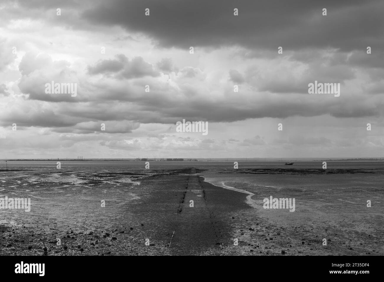 Black and white image of the pathway to the Thames at Westcliff, Essex, England, United Kingdom Stock Photo