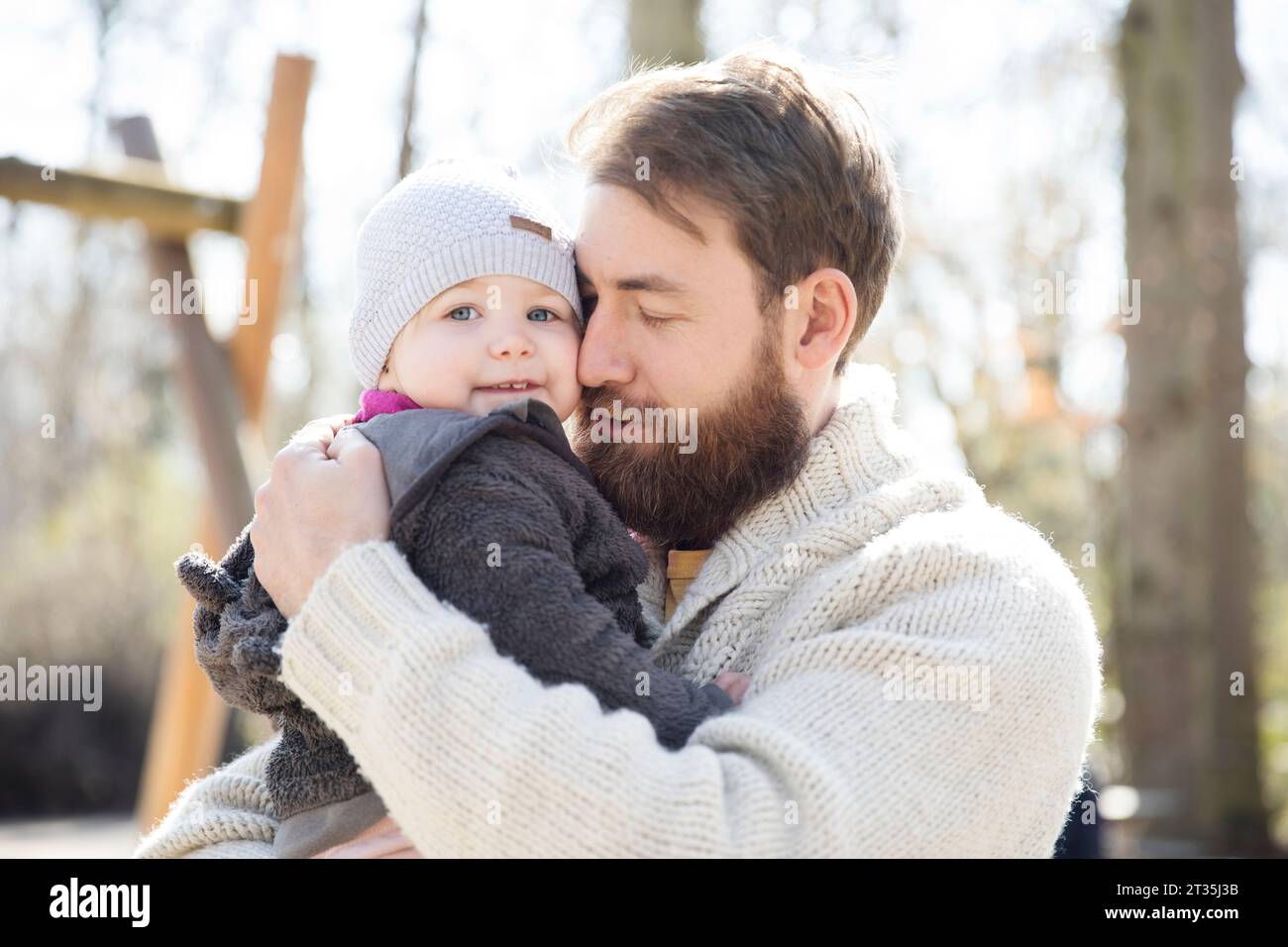 Affectionate father carrying daughter in park Stock Photo - Alamy