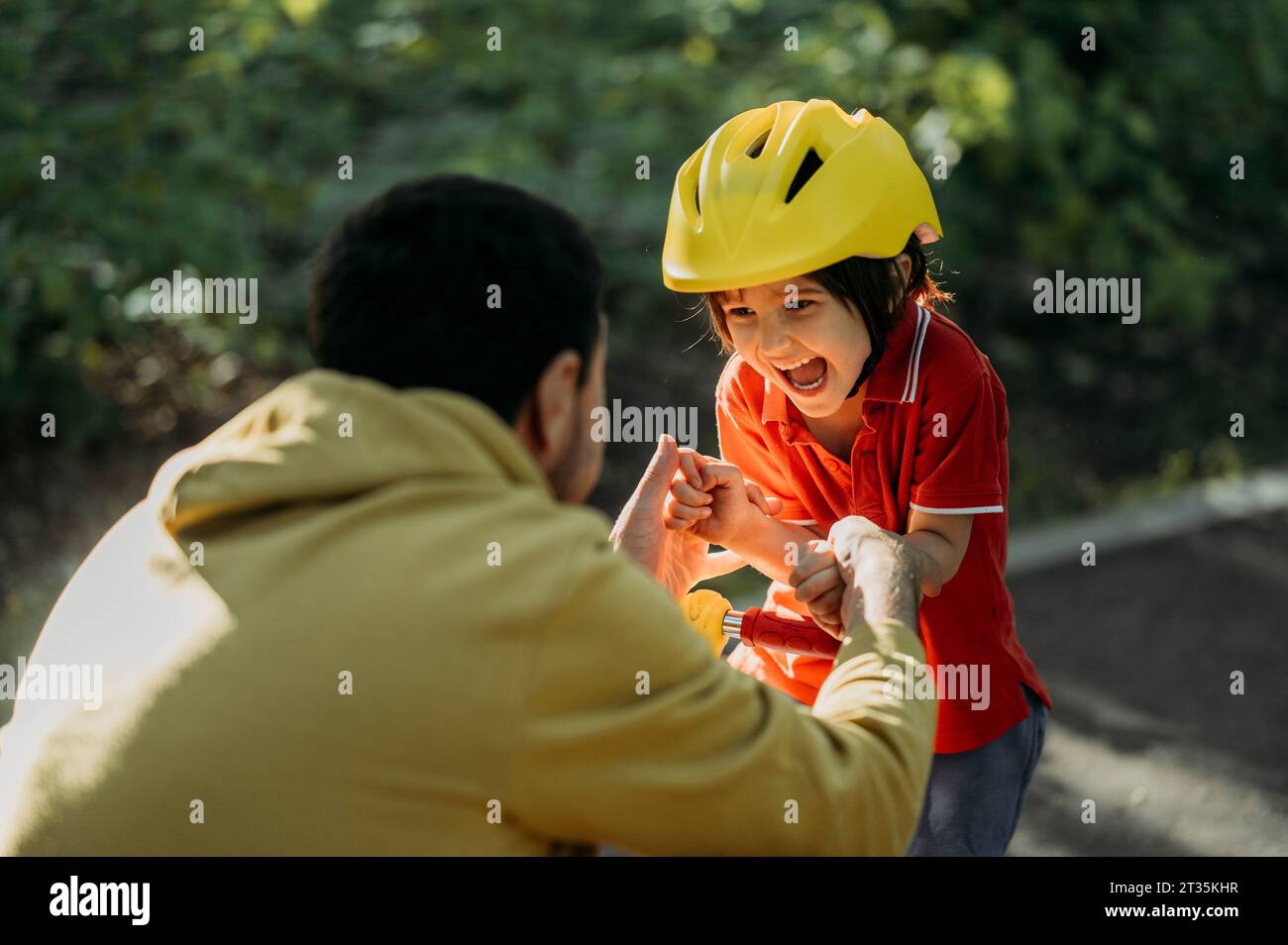 Playful father and son having fun Stock Photo - Alamy