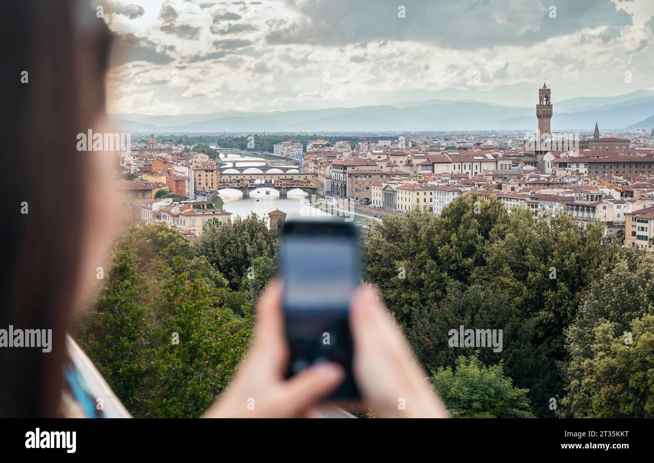 Female tourist capturing memories city hi-res stock photography and ...
