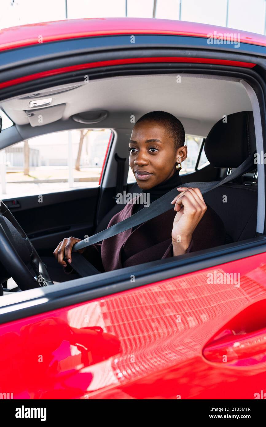 Woman adjusting car seat hi-res stock photography and images - Alamy
