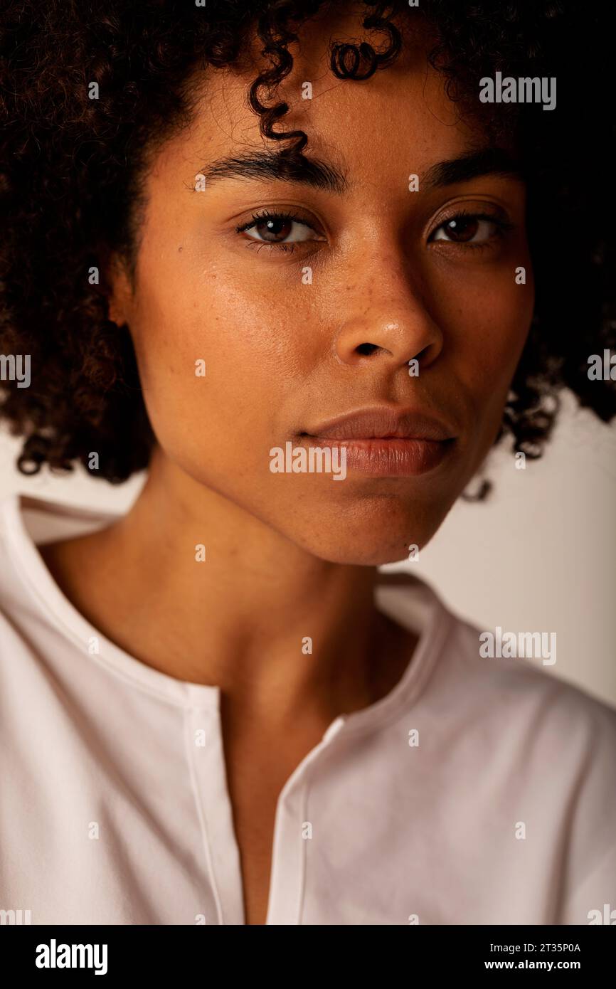 Young woman with curly hair Stock Photo