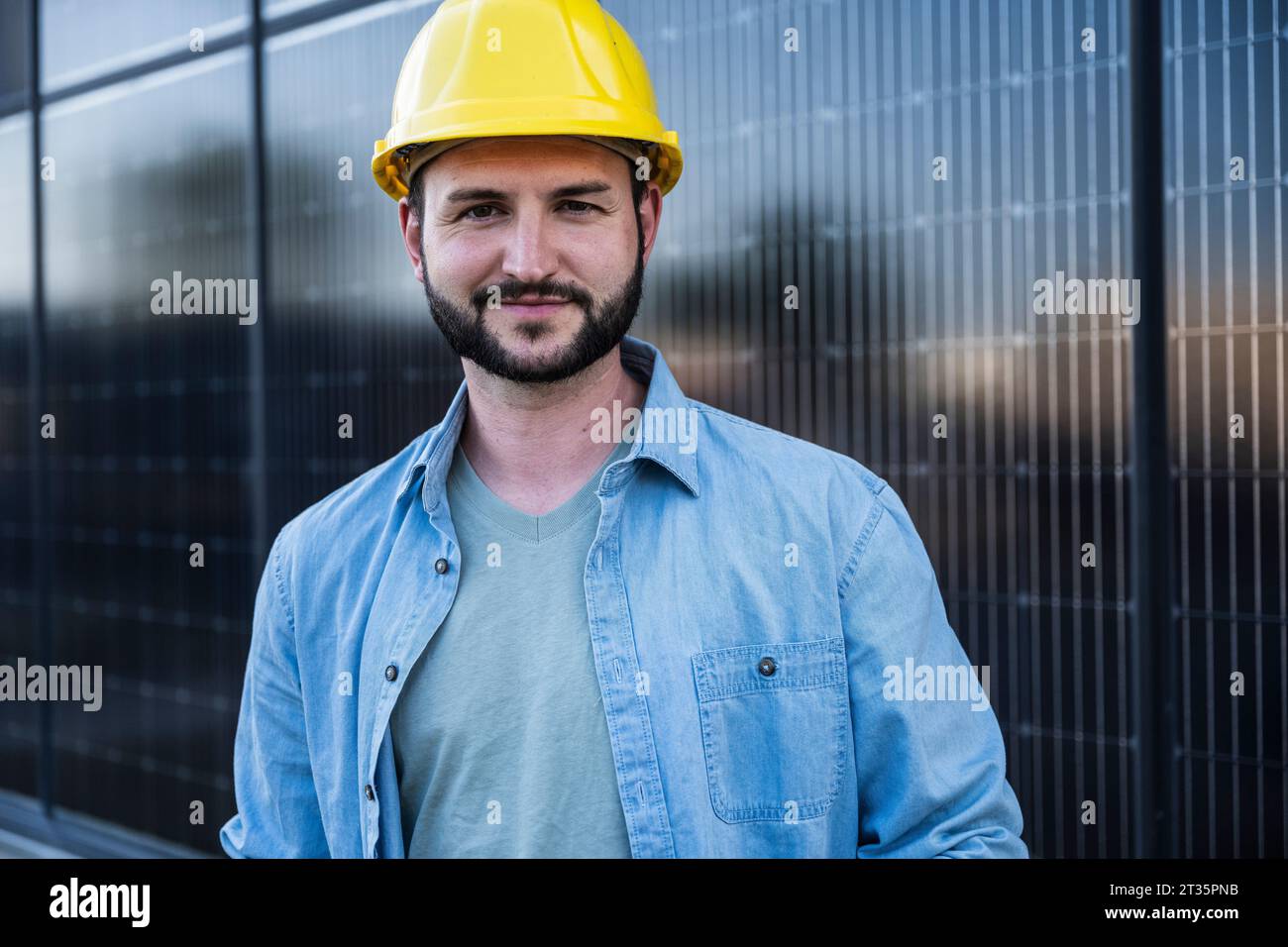 Confident engineer wearing yellow hardhat Stock Photo