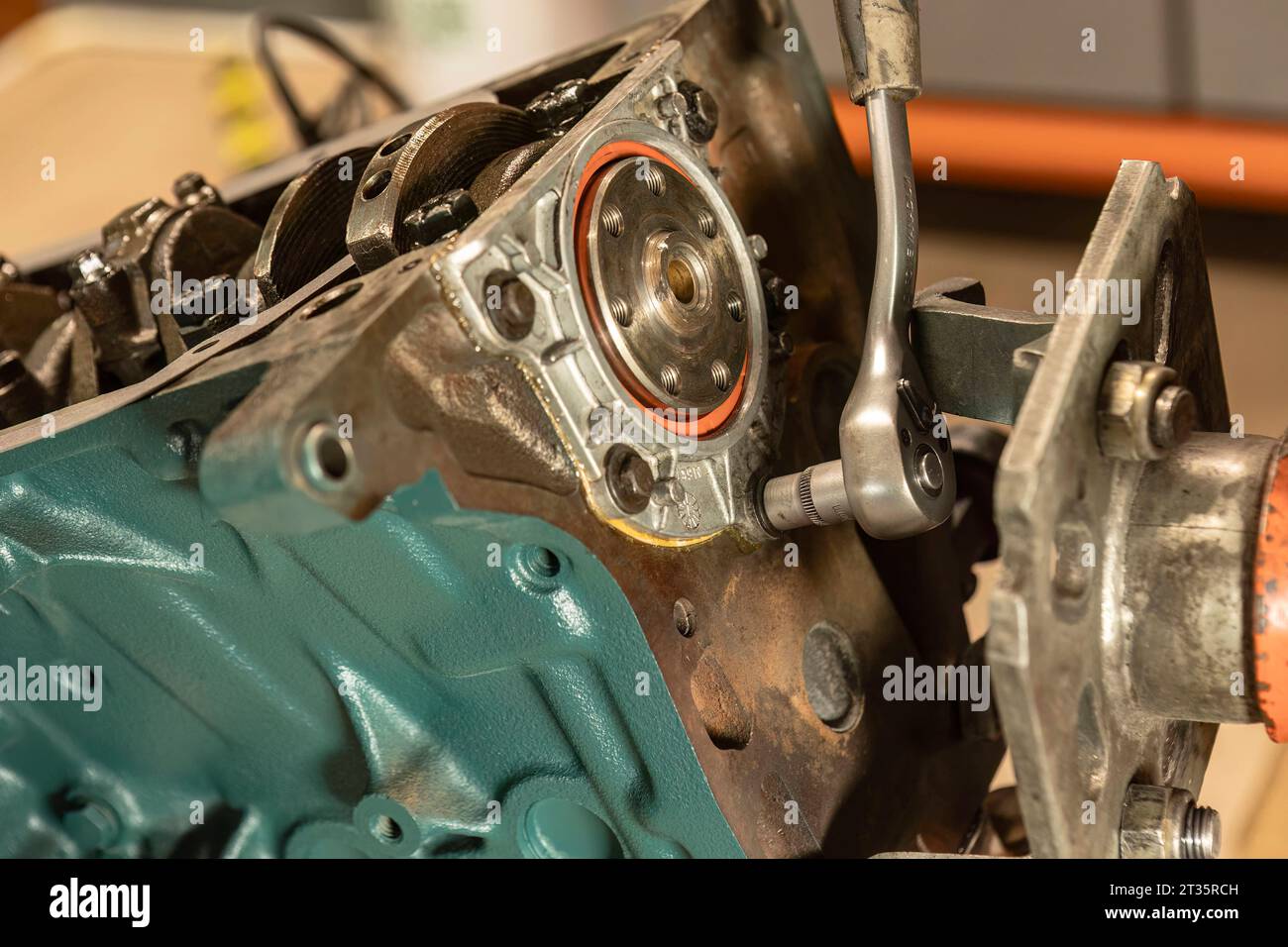 Closeup detailing the intricate process of restoring a vintage engine