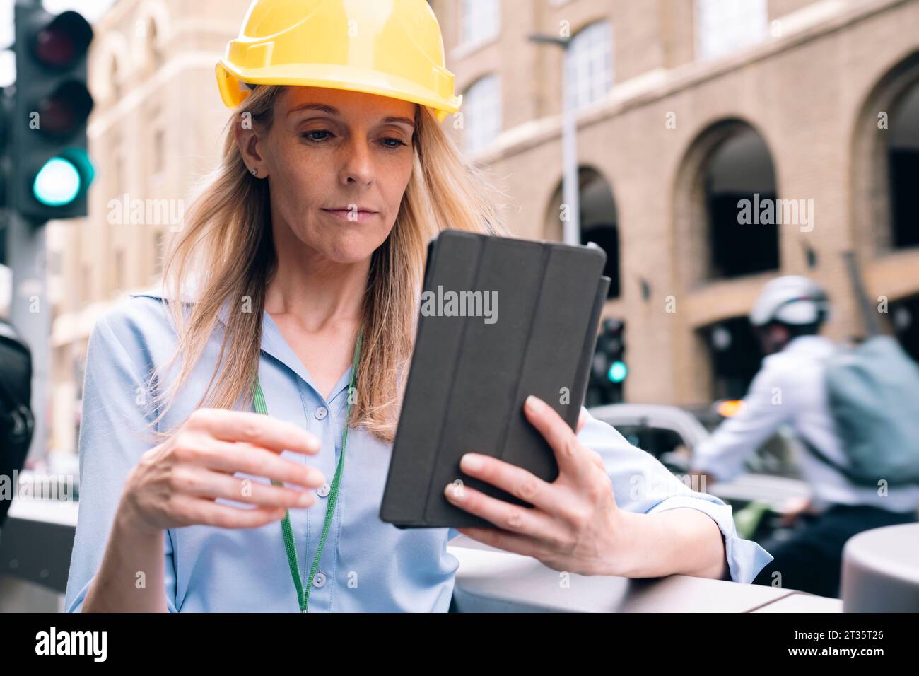 Engineer using tablet PC at street Stock Photo
