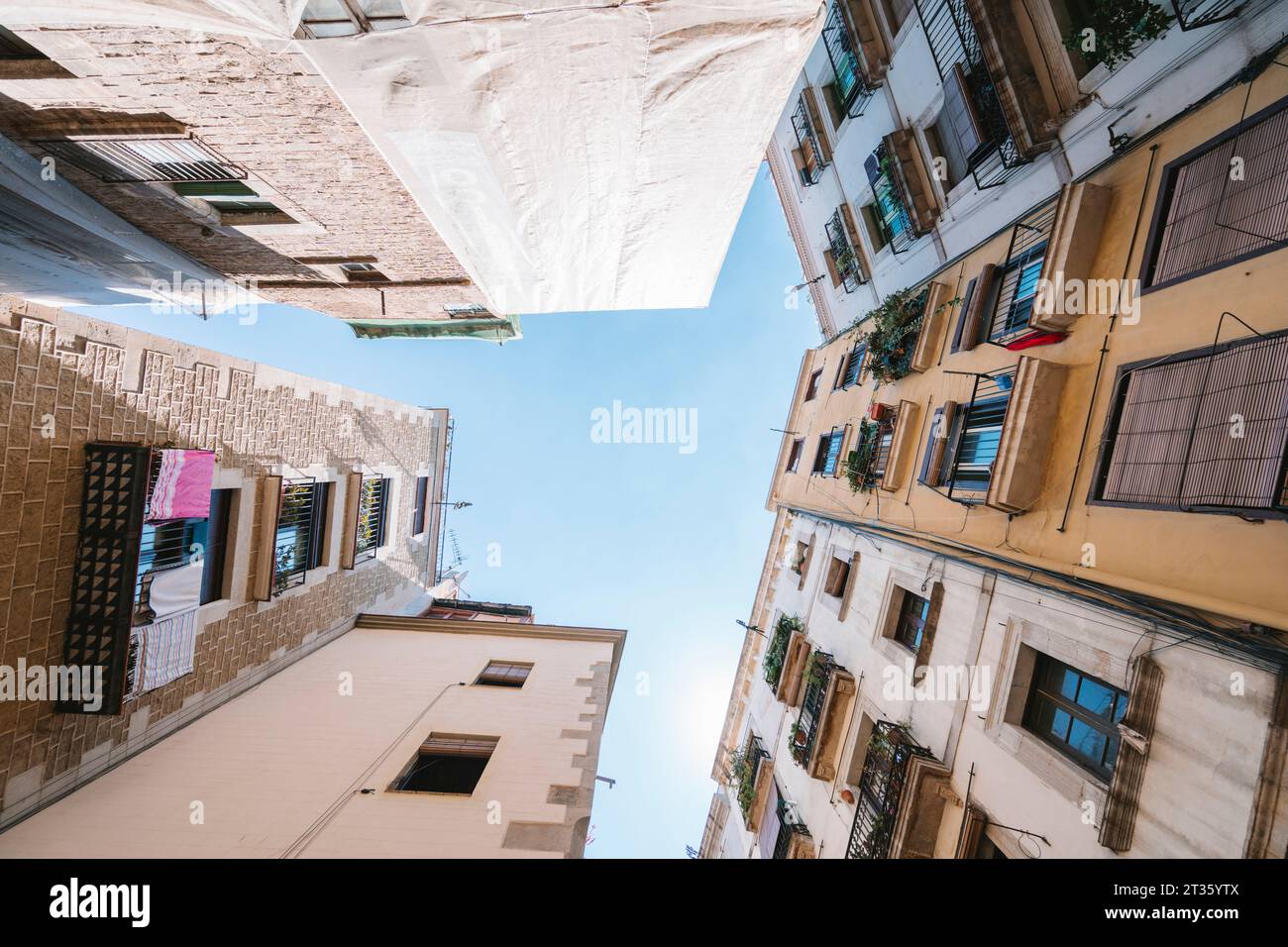 Spain, Catalonia, Barcelona, Directly below view of residential buildings in Gothic Quarter Stock Photo