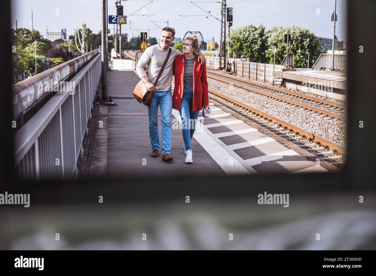 Happy man walking train station hi-res stock photography and images - Alamy