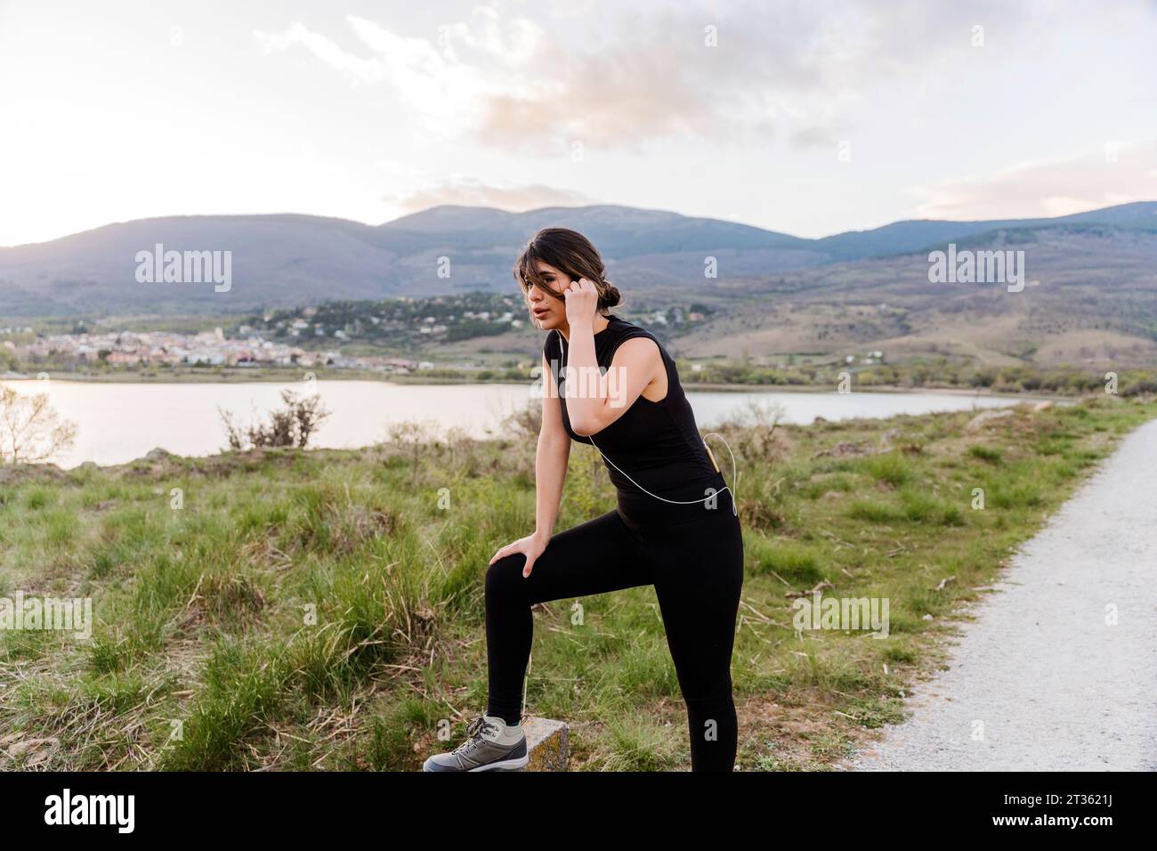 Woman running on mountain road hi-res stock photography and images - Alamy