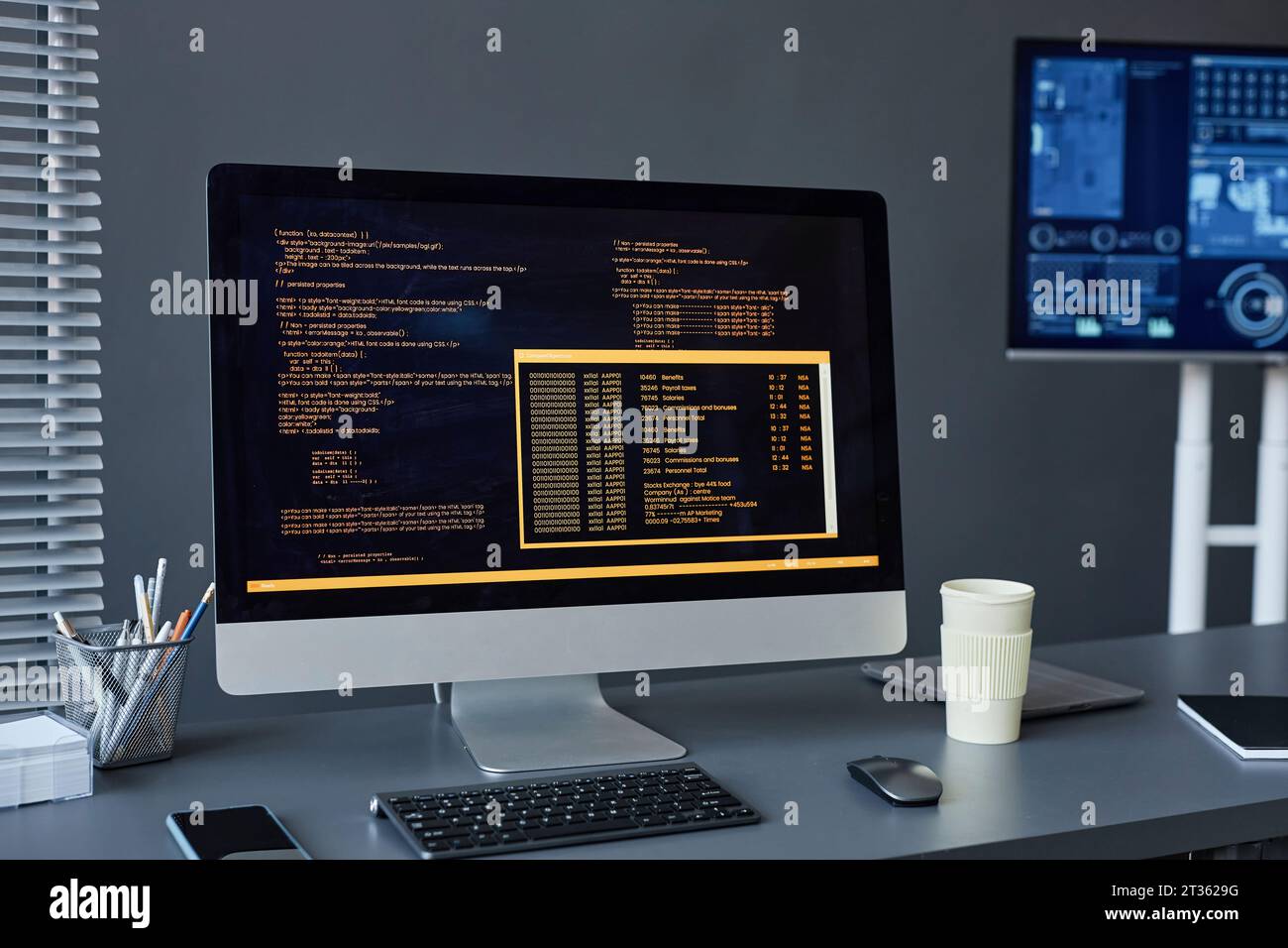 Desktop PC with text on screen on desk Stock Photo