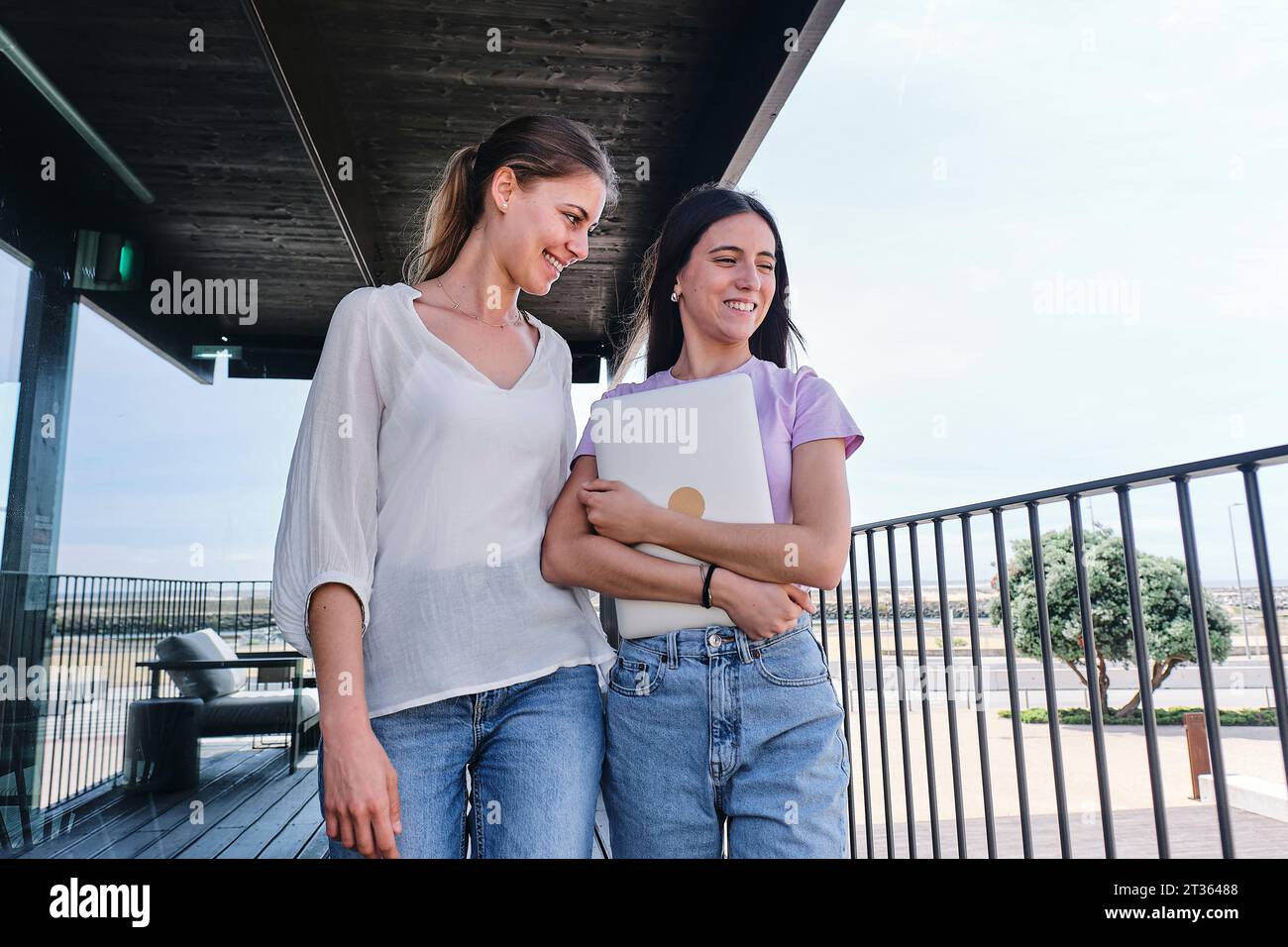 Two women standing together hi-res stock photography and images - Alamy