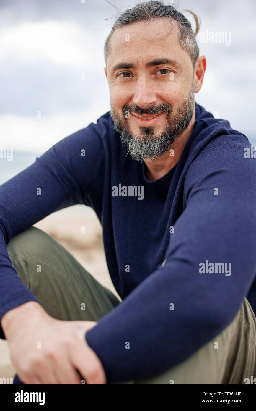 Smiling man beard sitting hi-res stock photography and images - Alamy