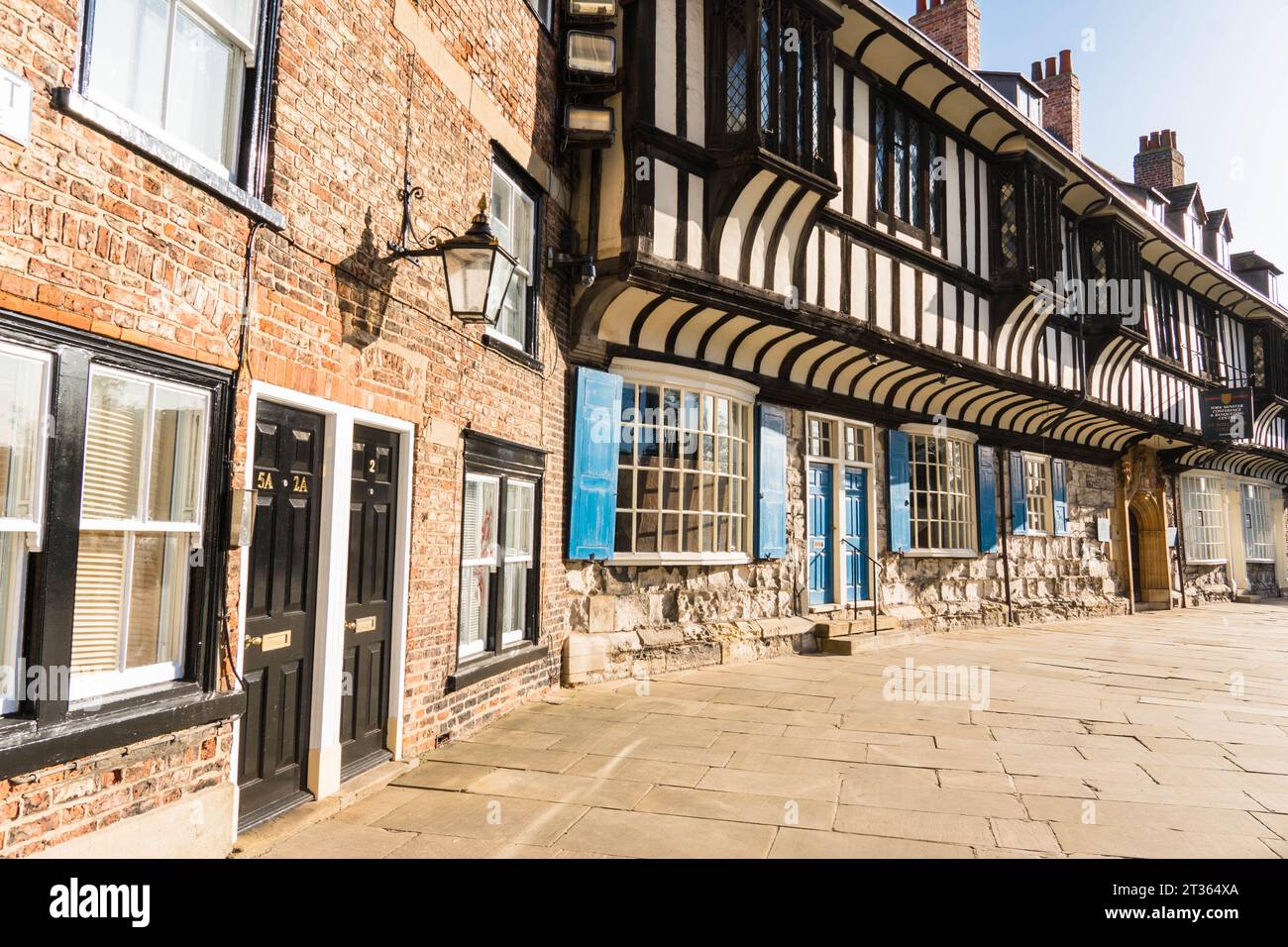 Red brick and half timbered properties that make up Minster Yard, York