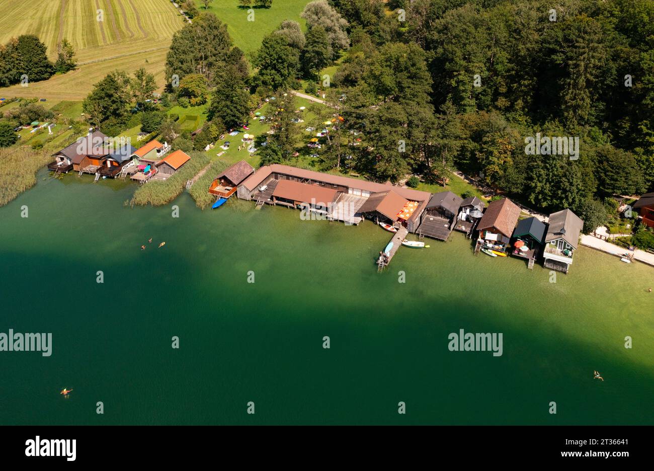 Austria, Upper Austria, Zell am Moos, Drone view of boathouses on shore of Irrsee lake in summer Stock Photo