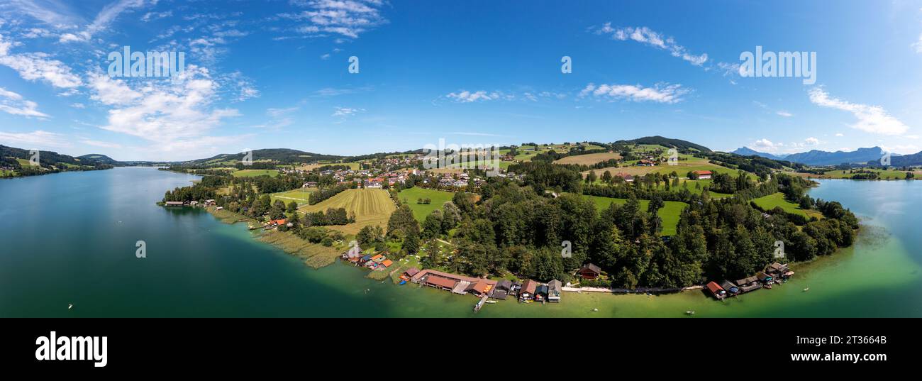 Austria, Upper Austria, Zell am Moos, Drone panorama of town on shore of Irrsee lake in summer Stock Photo