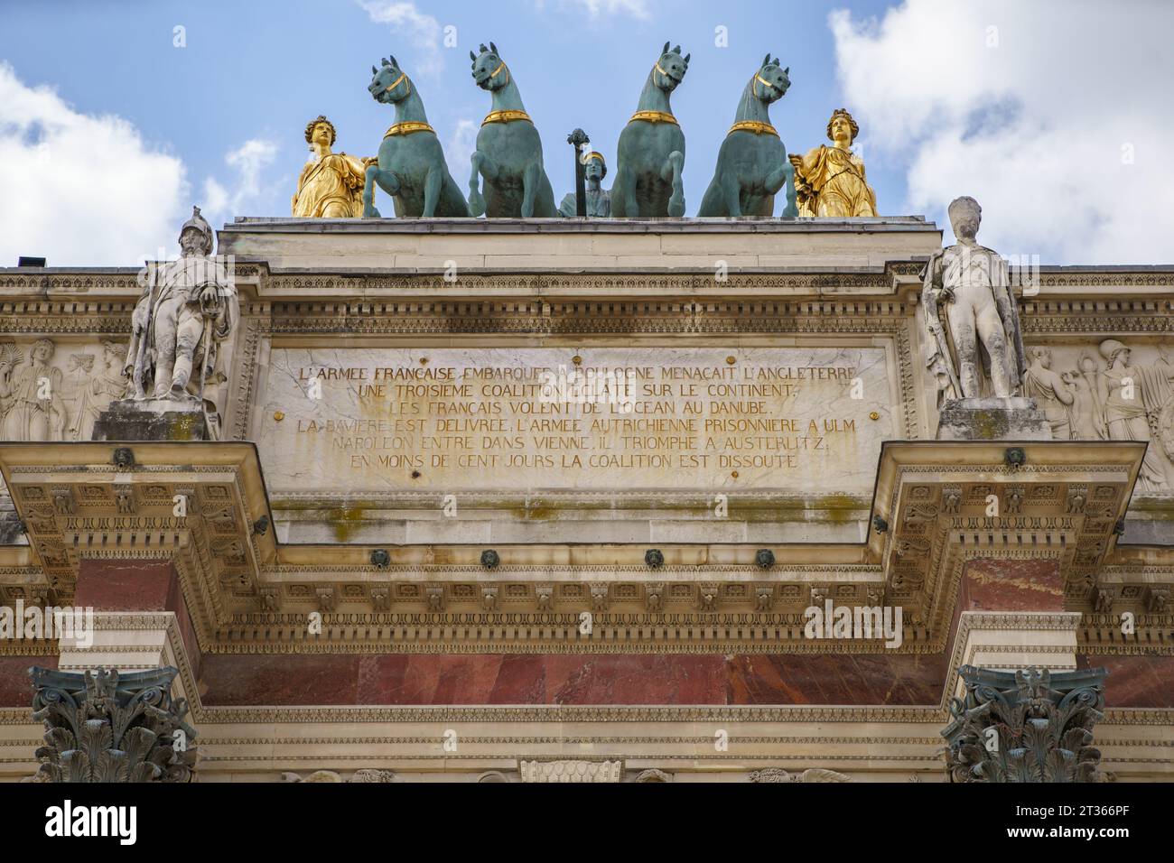 Statues and chariot on the Triumphal Arch of the Carousel (French: Arc de Triomphe du Carrousel) in close up. PARIS - 29 APRIL,2019 Stock Photo