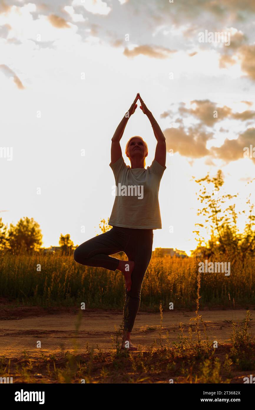 Tree pose yoga hi-res stock photography and images - Alamy