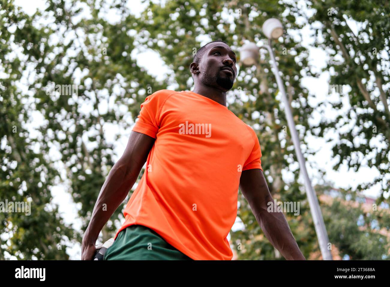Orange shirt on man hi-res stock photography and images - Alamy
