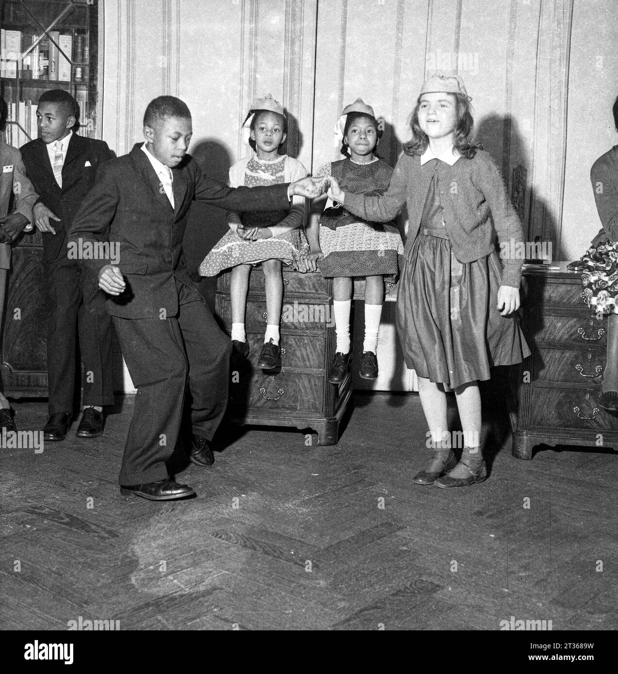 Windrush children enjoy a party with the locals in London in the 1950s Stock Photo