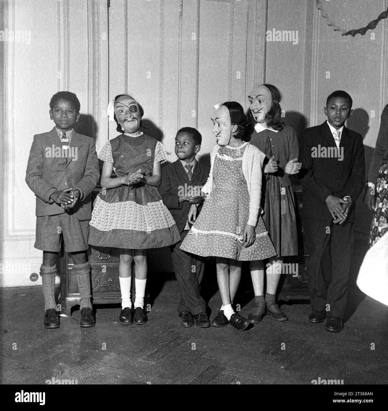 Windrush children enjoy a party with the locals in London in the 1950s Stock Photo