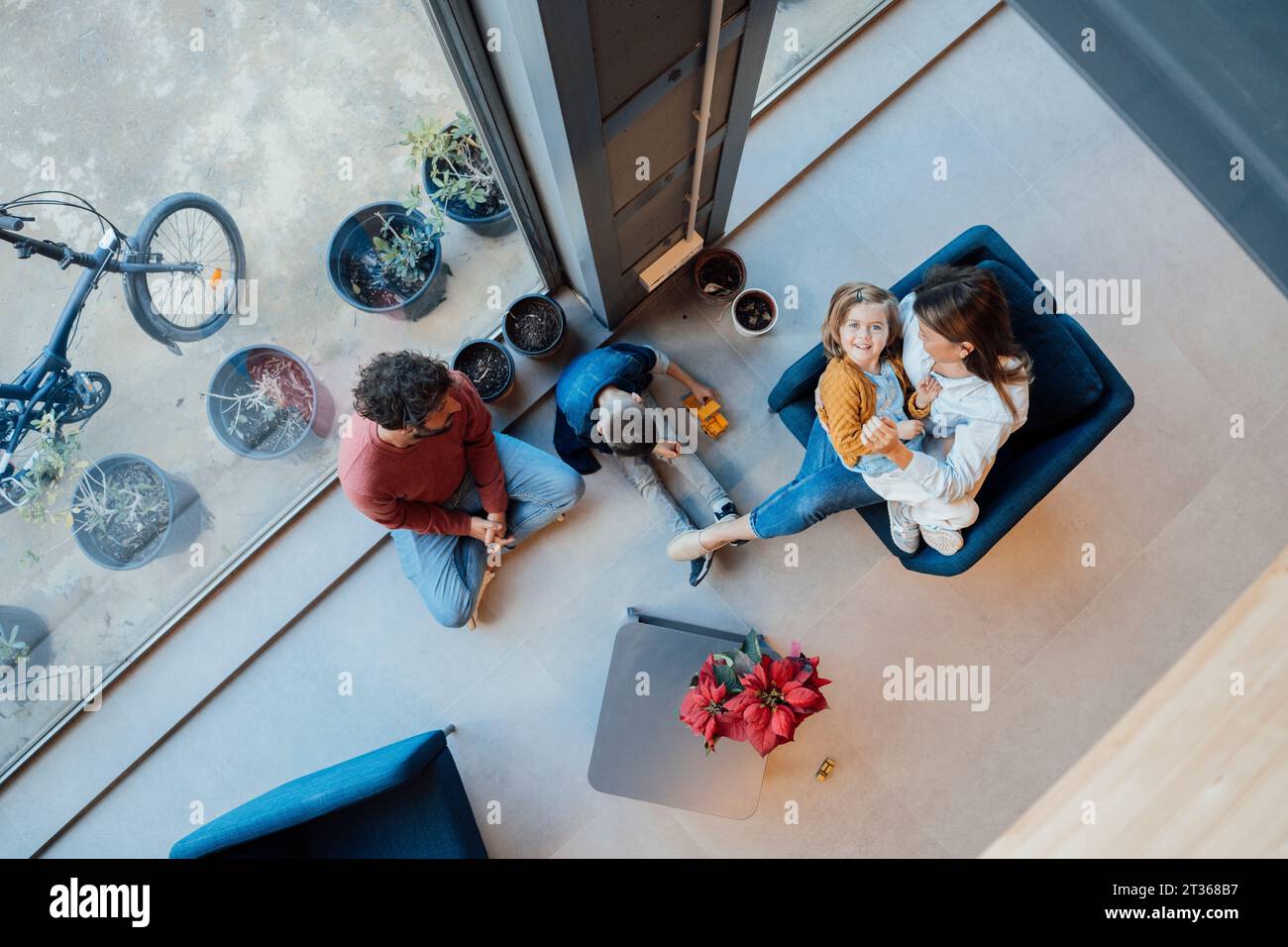 Family spending leisure time sitting at home Stock Photo